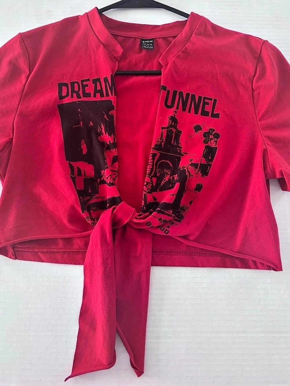 Red and black Graphic Crop Top w/ Front tie. Crop Top in Red size medium. Tight